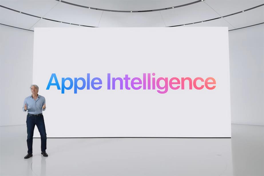 Apple SVP of software engineering Craig Federighi in front of a backdrop reading 'Apple Intelligence'