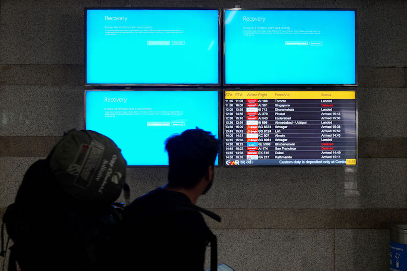 Airport digital boards in New Delhi, India, display error messages due to the CrowdStrike outage