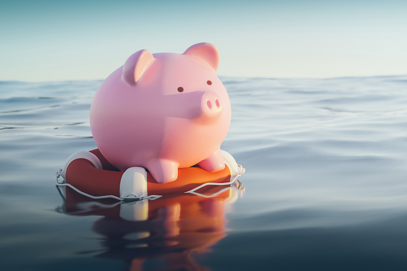 Piggybank floating on life preserver