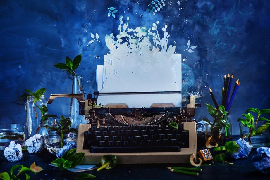 Graphic image of typewriter against blue background 