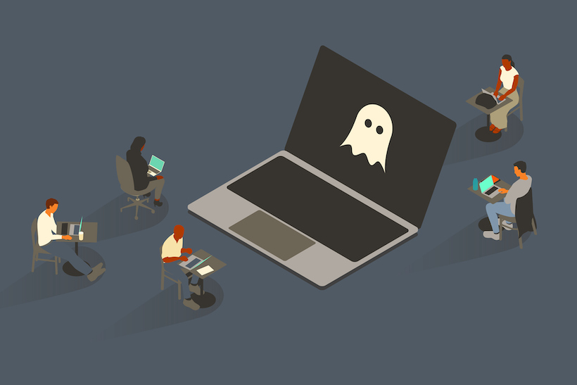 Five people surround an oversized laptop with a ghost icon on-screen