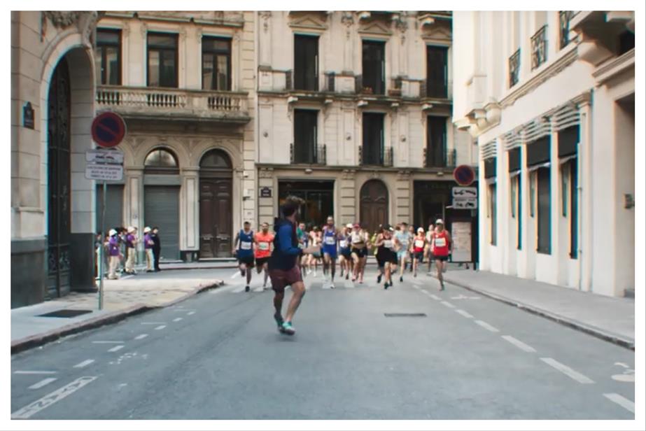 A man running away from a group of Olympic runners