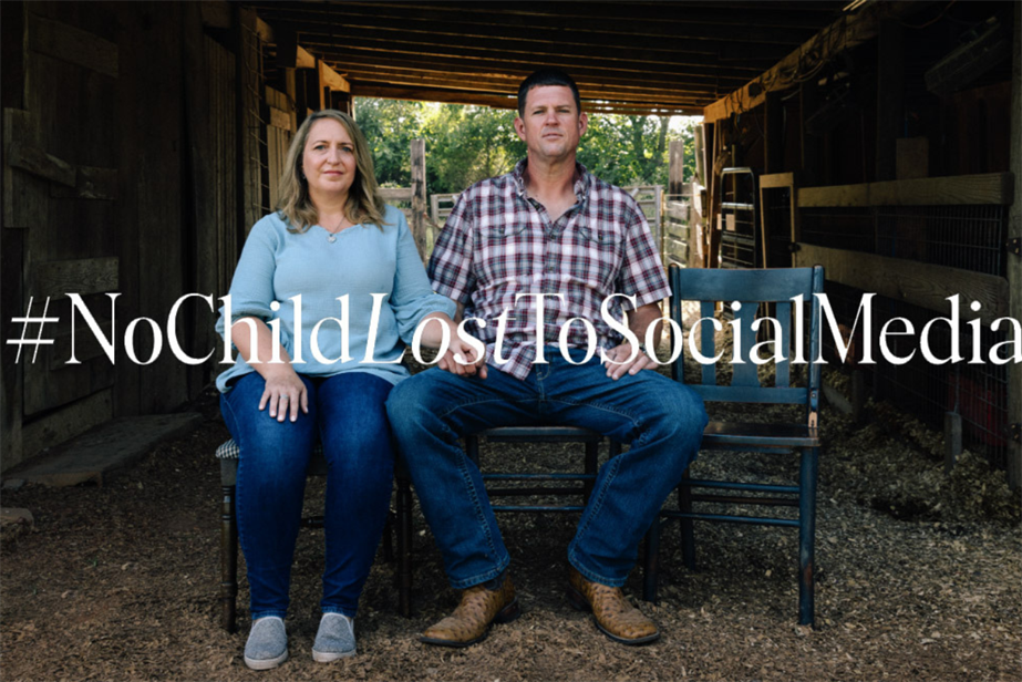 two parents of a victim of suicide sitting on a bench in the barn where their daughter took her life