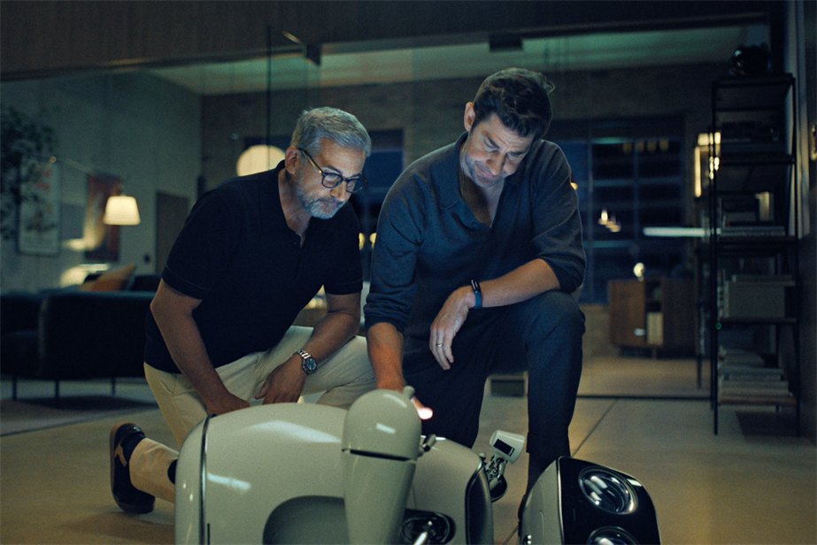 Steve Carell and John Krasinki looking down at Luigi the Lavazza robot